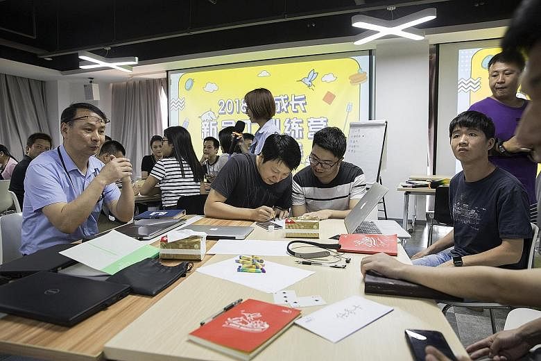 New staff during a team-building event at the Anker Innovations Technology office in Shenzhen, China. Anker sells products ranging from smartphone chargers to portable power banks on Amazon.com, and has reached a deal to put products in almost 4,000 