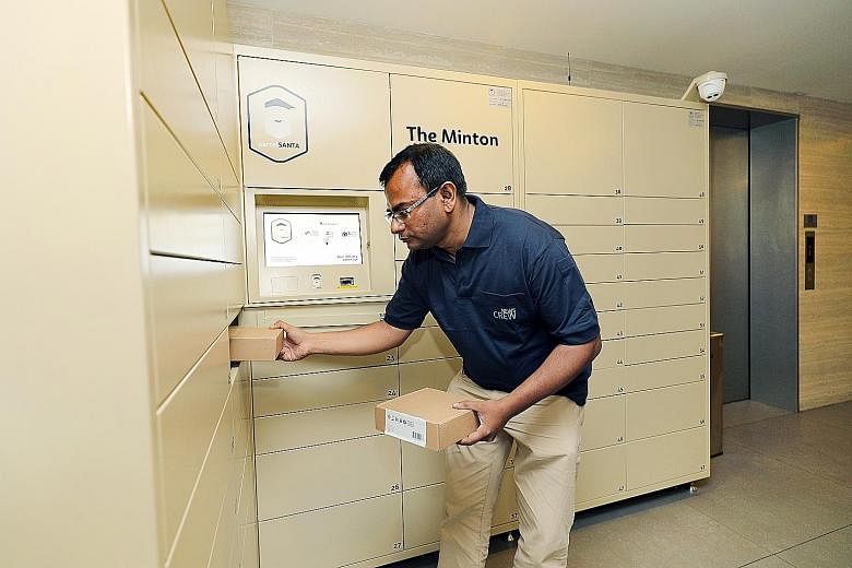 Parcel Santa will partner SPH and tap its network to make deliveries to parcel lockers located in 100 condominium precincts. (Left) An SPH employee shows how parcels can be delivered at the Minton condominium.