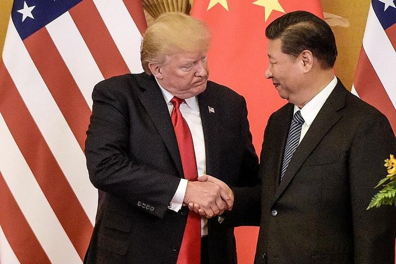 US President Donald Trump and Chinese President Xi Jinping during a meeting on Nov 9 last year in Beijing. US administration officials have tried to cast the latest trade talks as a victory, but some supporters of Mr Trump questioned if he had blinke