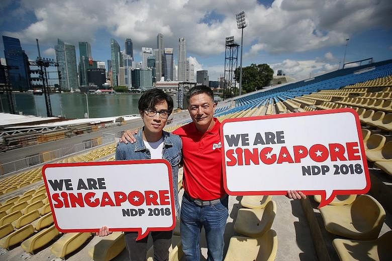 NDP 2018 executive committee chairman, Brigadier-General Alfred Fox (right), and singer Charlie Lim holding up this year's parade logo at the launch yesterday.