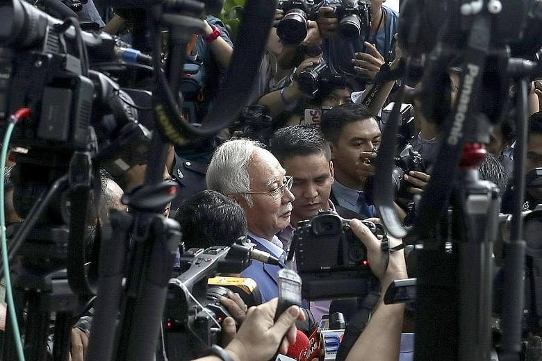 Former Malaysian prime minister Najib Razak leaving the Malaysian Anti-Corruption Commission headquarters in Putrajaya yesterday. He was questioned for five hours over transactions involving state firm SRC International, which was once a subsidiary o