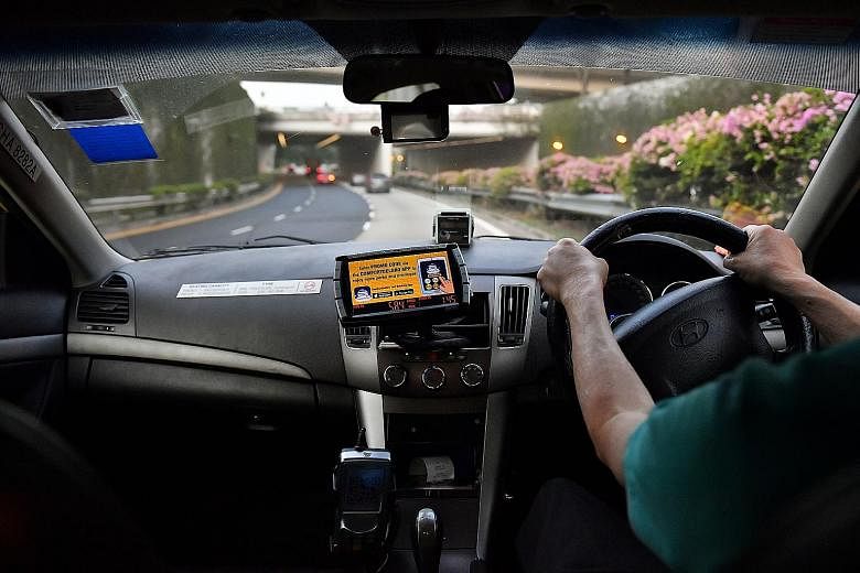 A ComfortDelGro cab with a forward-facing camera. In 2013, the operator installed inward-facing cameras in its taxis, but has since removed all of them.