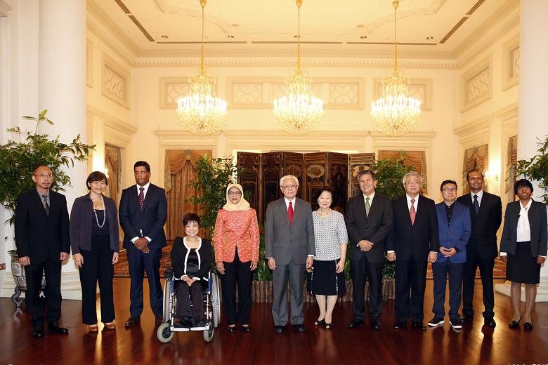 Then Speaker Halimah Yacob, then President Tony Tan Keng Yam, and his wife, Mary, being flanked by the current lineup of Nominated MPs after their appointment on March 22, 2016. (From left) Labour economist Randolph Tan; social entrepreneur Kuik Shia