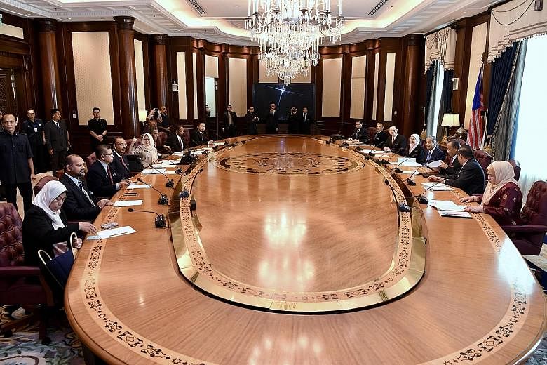 Malaysian Prime Minister Mahathir Mohamad and his Cabinet ministers at their first meeting yesterday in Putrajaya after the May 9 polls.