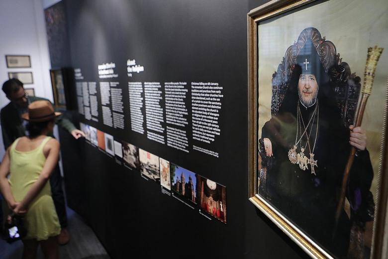 The new Armenian Heritage Gallery features rare artefacts, books, photos and other historical items. Church trustees (back row from left) Pavel Karapetyan and Gevorg Sargsyan with trustee Pierre Hennes and volunteer Sandra Basmadjian.