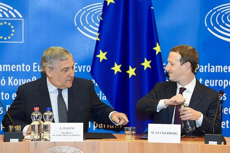 European Parliament president Antonio Tajani (left) and Facebook CEO Mark Zuckerberg in Brussels on Tuesday.