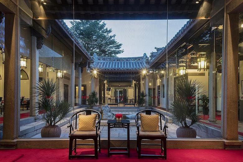 The waiting lounge overlooking the courtyard at Ming Yi Guan, which opened last year on the site as Beijing Hospital of TCM's first treatment facility outside China. The House of Tan Yeok Nee, gazetted as a national monument in 1974, was built in the