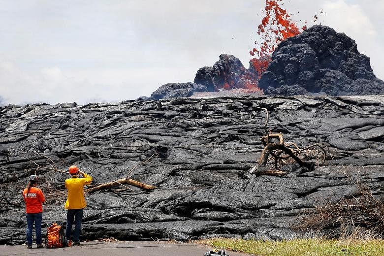 Lava erupting from a fissure in the Leilani Estates near Pahoa, Hawaii, earlier this week. On Thursday evening, Kilauea volcano erupted at its summit, sending ash 3,000m into the air.