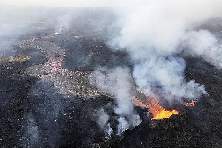 Channellised lava flows from fissures on Kilauea in Hawaii spilling into the ocean on Thursday. Geologists said that after three weeks of escalating activity, Kilauea volcano has entered a "steady state" of eruption.