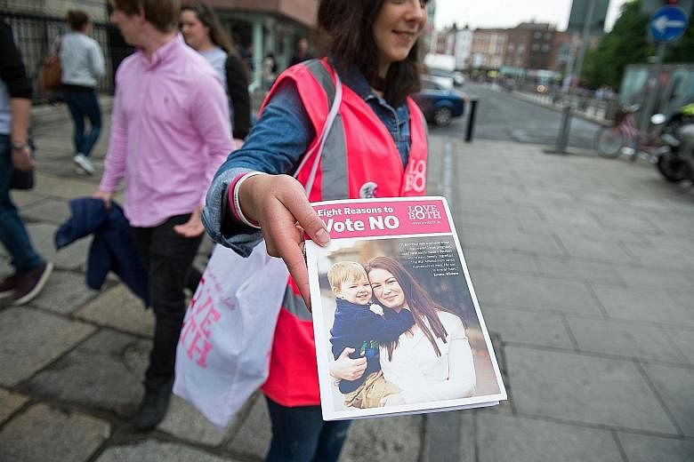 Voters in Ireland are being asked if they wish to scrap a 1983 amendment to the Constitution that gives an unborn child and its mother equal rights to life.