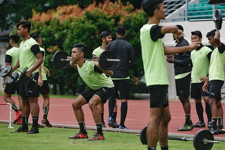 Home United defender Faizal Roslan lifting weights during a training session at Bishan Stadium on Wednesday. The Singapore Premier League side can move into the top half of the table with a win over third-placed Brunei DPMM FC today.