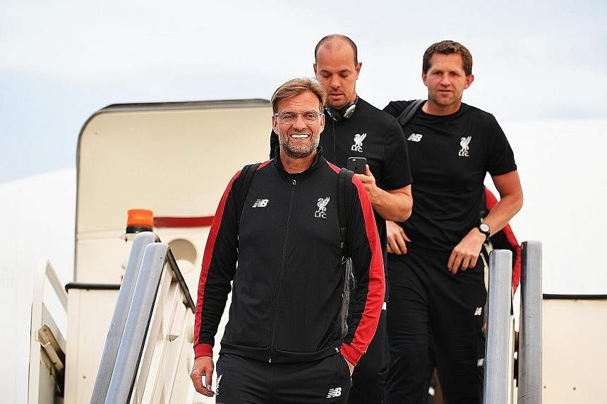 Real Madrid coach Zinedine Zidane and Liverpool manager Jurgen Klopp (above) arriving in Kiev ahead of the Champions League final today. If Real prevail, they will become the first team since Bayern Munich in 1976 to record three consecutive European triu