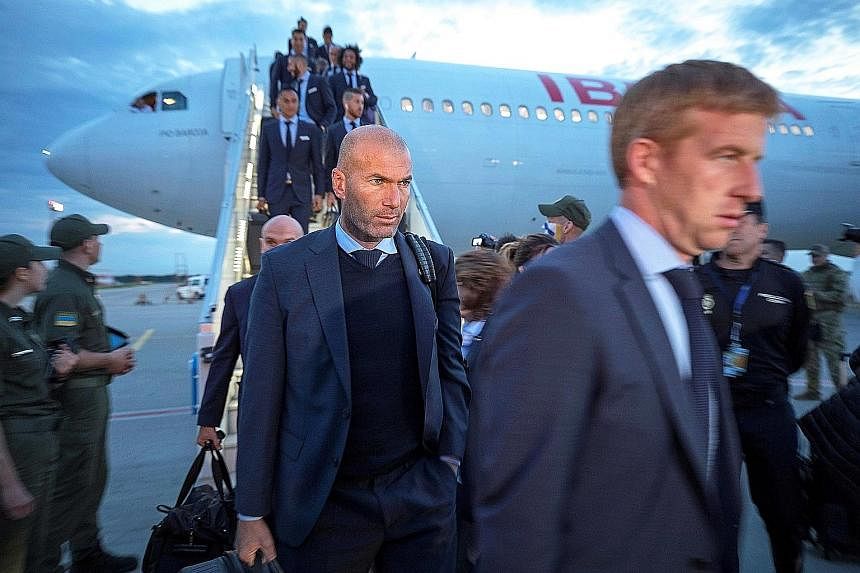 Real Madrid coach Zinedine Zidane (above) and Liverpool manager Jurgen Klopp arriving in Kiev ahead of the Champions League final today. If Real prevail, they will become the first team since Bayern Munich in 1976 to record three consecutive European triu