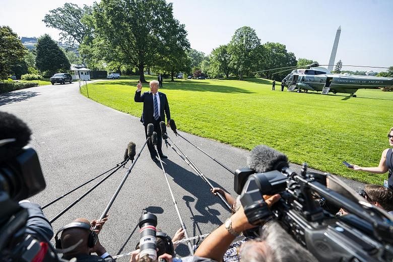 US President Donald Trump speaking to the media before he boarded his Marine One helicopter at the White House in Washington yesterday. He said the US and North Korea were talking, adding: "They very much want to do it. We would like to do it."