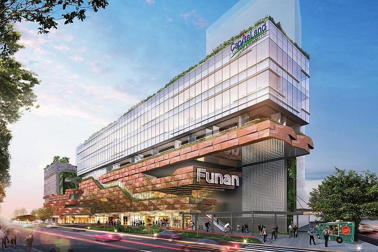 Artist's impressions of the robotic arm (left) at the Funan mall (above), opening next year.