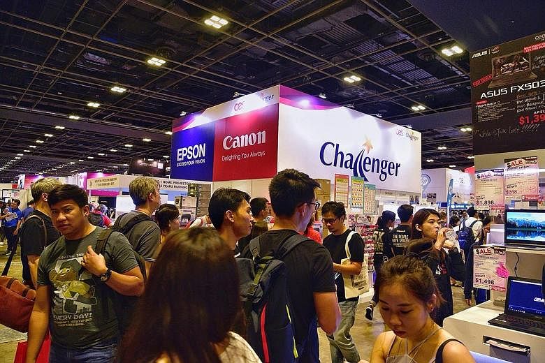 Large crowds are seen scoping out this year's line-up of the latest gadgets and cashing in on discounts of up to 90 per cent at the Consumer Electronics Exhibition.