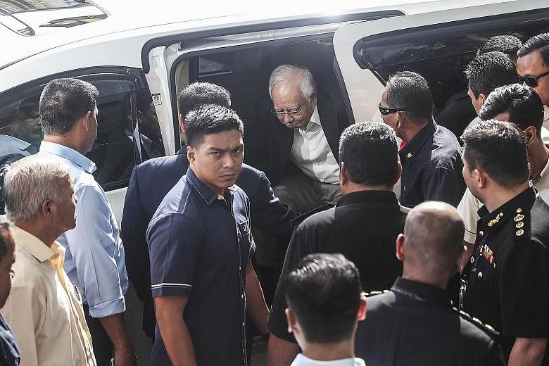 Former Malaysian prime minister Najib Razak arriving at the Malaysian Anti-Corruption Commission's headquarters in Putrajaya last Thursday to answer investigators' questions on SRC International, a former subsidiary of troubled state fund 1MDB. Mr Na