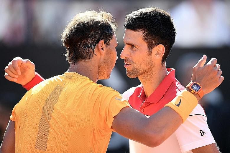 Rafael Nadal (left) is congratulated by Novak Djokovic after the world No. 1 won a hard-fought semi-final in Rome on May 19. They can meet in Paris only in the final.