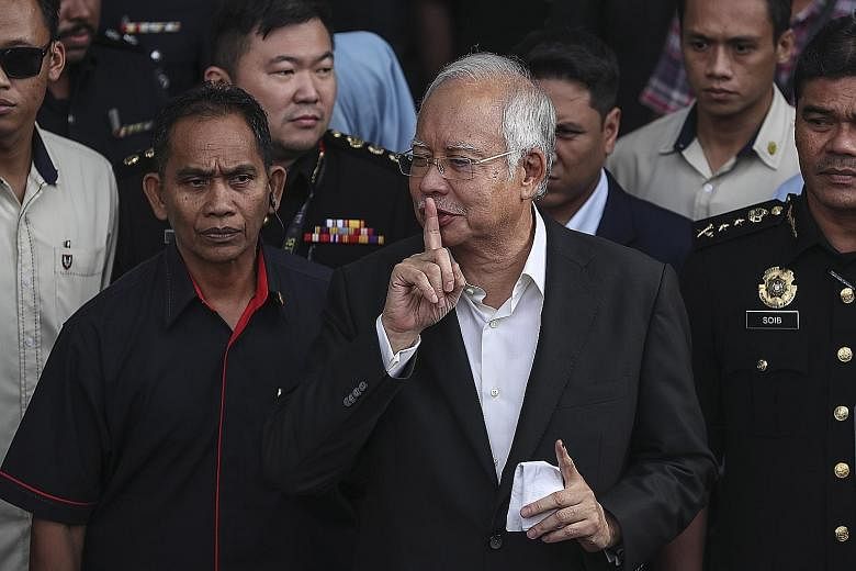 Former Malaysian prime minister Najib Razak leaving the Malaysian Anti-Corruption Commission headquarters in Putrajaya on Thursday. The agency's chief, Datuk Seri Mohd Shukri Abdull, said he "nearly died" when first investigating 1Malaysia Developmen