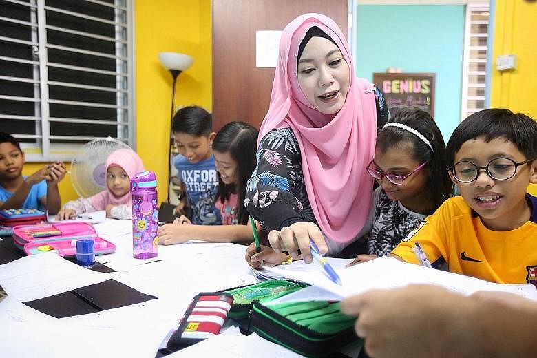 Madam Nurhidayah Mohamed Ismail, who runs Genius Young Minds, with a Primary 6 maths tuition class. She said her tuition centre started with a class of 10 pupils in 2013 and expanded to nearly 200 children across two branches.