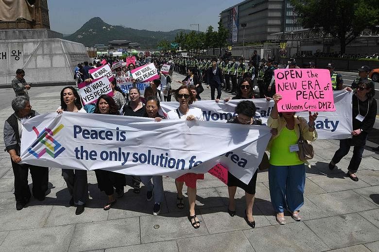 Peace activists marching during a rally against US President Donald Trump in Seoul last Friday. Mr Trump had called off a summit with North Korean leader Kim Jong Un that would have been held in Singapore on June 12. Hopes for the summit have since b