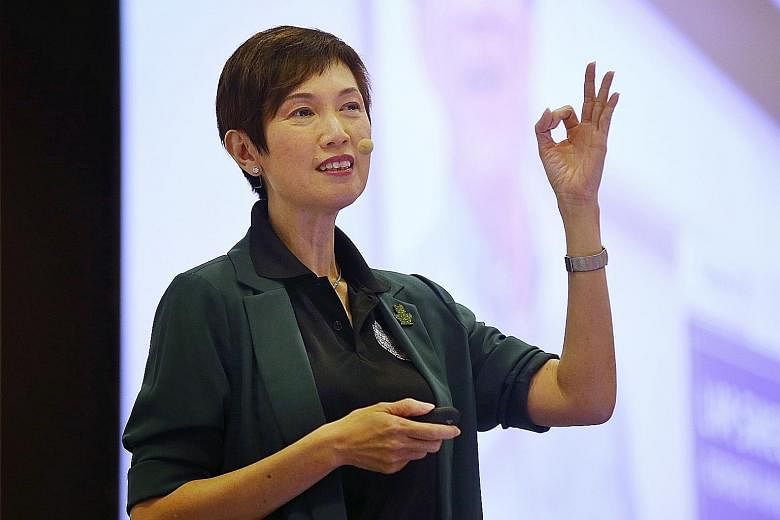 Manpower Minister Josephine Teo (above), speaking at her ministry's Work Plan seminar yesterday, noted that labour MPs have raised the concerns of older workers (right), who "have anxieties about the future, particularly as technology disrupts busine