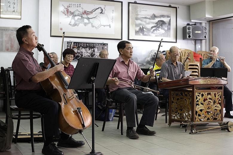 Some members of the Thau Yong amateur musical association (from left): Mr Tan Gee Seng, 67, on the cello; Mr Chow Kok Yong on the tihu; Mr Yeo Eiong Lok, 76, on the yangqin;, and Mr Sim Song En, 80, on the dizi at Kityang Huay Kwan's headquarters. Mr