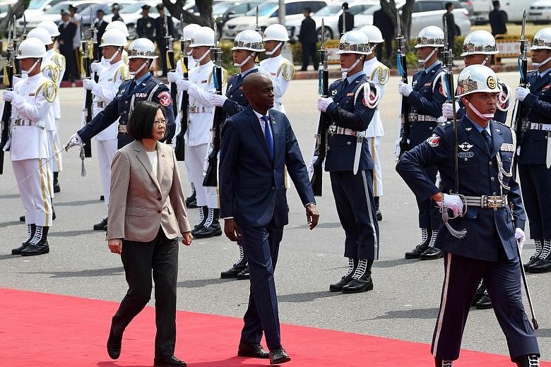 Visiting Haitian President Jovenel Moise inspecting a guard of honour, accompanied by Taiwanese President Tsai Ing-wen, during a welcoming ceremony in Taipei yesterday. Taiwan and Haiti have been allies since 1956, and there are concerns in Taipei th
