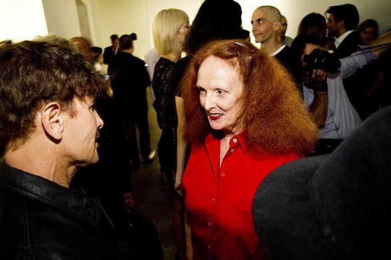 Louis Vuitton designer Nicolas Ghesquiere sent red-haired models down a catwalk at the Maeght Foundation art gallery and gardens in a nod to Grace Coddington's trademark mane.