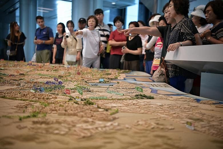 Visitors at the Underground: Singapore's Next Frontier exhibition yesterday. National Development Minister Lawrence Wong, who was at the opening of the exhibition, detailed plans for subterranean development, including that for the new 230kV station 