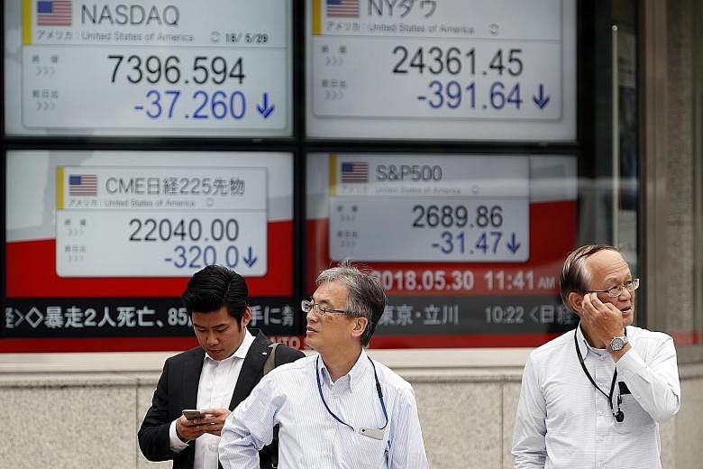 From left: Stock markets in Shanghai, South Korea and Tokyo slumped as the brewing Italian political storm hammered regional bourses. On the foreign exchange front, the euro continued its tumble against the Singapore dollar and greenback. Comparing I