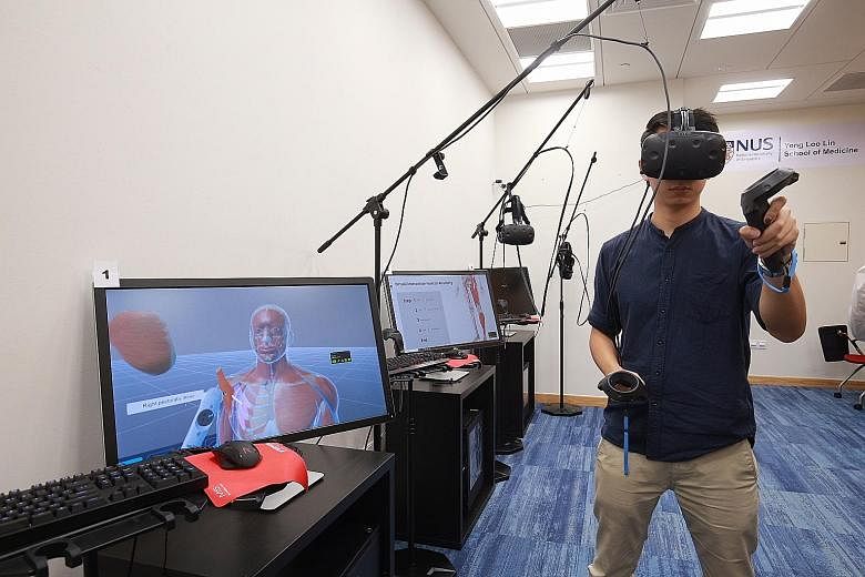 The Virtual Interactive Human Anatomy (VIHA) system allows students wearing a VR headset to delve into the anatomy of a human body by freely manipulating and looking inside different parts and structures, using a controller in their hands.