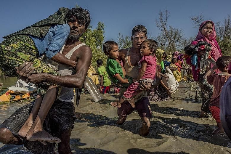 Rohingya from Myanmar crossing into Bangladesh last year. Myanmar's upcoming deal with two UN agencies to facilitate the refugees' repatriation has raised hopes that international access will be widened in Rakhine.