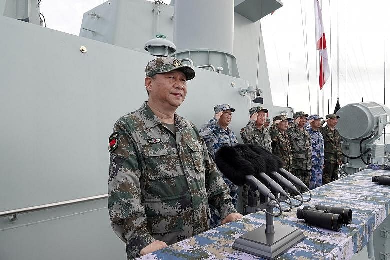 Chinese President Xi Jinping speaking after he reviewed a military display of the Chinese People's Liberation Army Navy in the South China Sea earlier this year. Beijing's main diplomatic tactic is to pose false choices and force choices between them