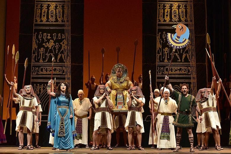 Set in ancient Egypt, Aida boasts a big set with lush costumes (above) as well as a big cast, including Martin Ng and Jee-Hye Han (both left).