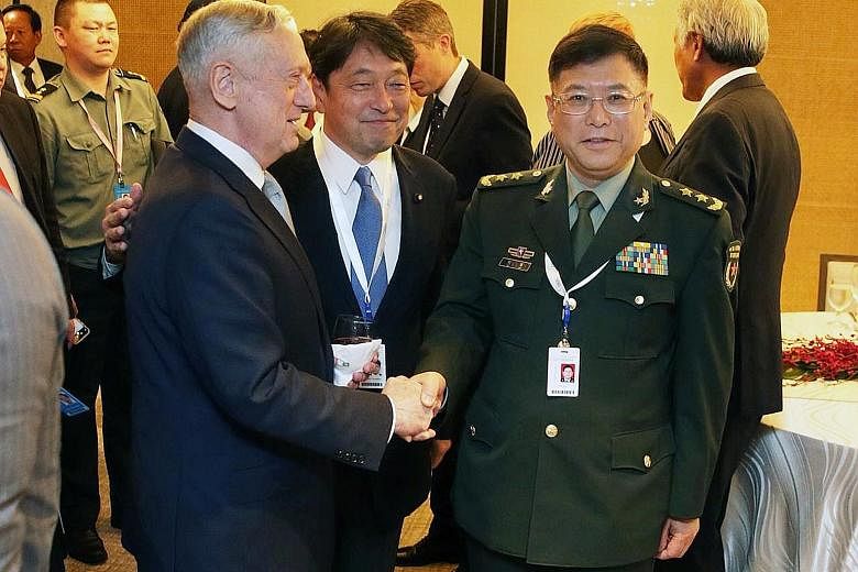 US Defence Secretary James Mattis, Japanese Defence Minister Itsunori Onodera and China's Lt-Gen He Lei at the dialogue. Mr Mattis said China's placement of weapon systems in the South China Sea is tied directly to military use for the purpose of int