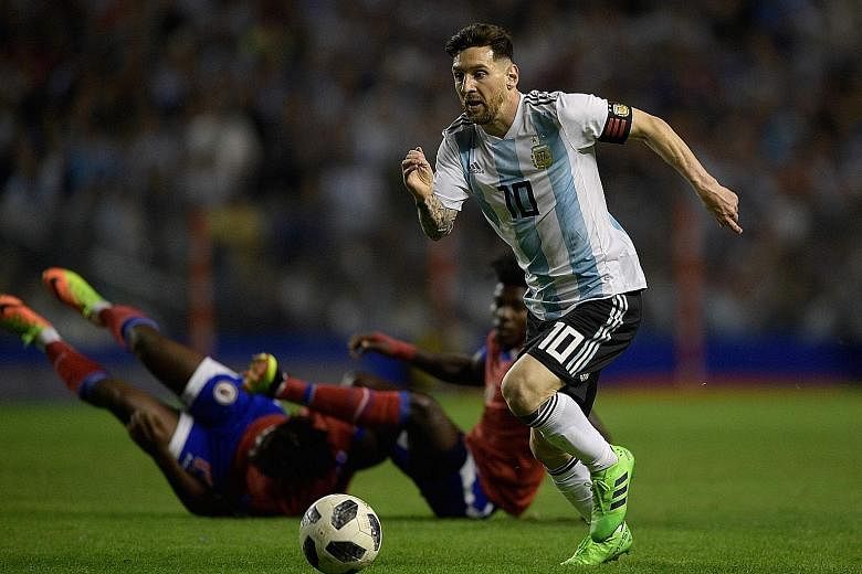 Lionel Messi leaving Haiti players in his wake as he scored a hat-trick in a World Cup warm-up match on Tuesday. The star striker has not won a major trophy with Argentina despite reaching the finals of the 2014 World Cup and the Copa America in 2007