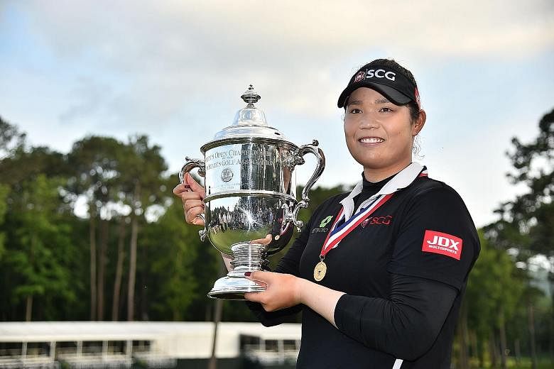 Thailand's Ariya Jutanugarn with her US Women's Open trophy after beating South Korea's Kim Hyo Joo in the fourth play-off hole at the Shoal Creek, Alabama course on Sunday.