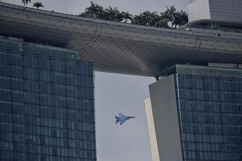 The Republic of Singapore Air Force (RSAF) flew an F-15 fighter jet yesterday to give reporters a preview of this year's aerial display for the National Day Parade. The jet is painted blue with the number 50 on its side to celebrate the RSAF's golden