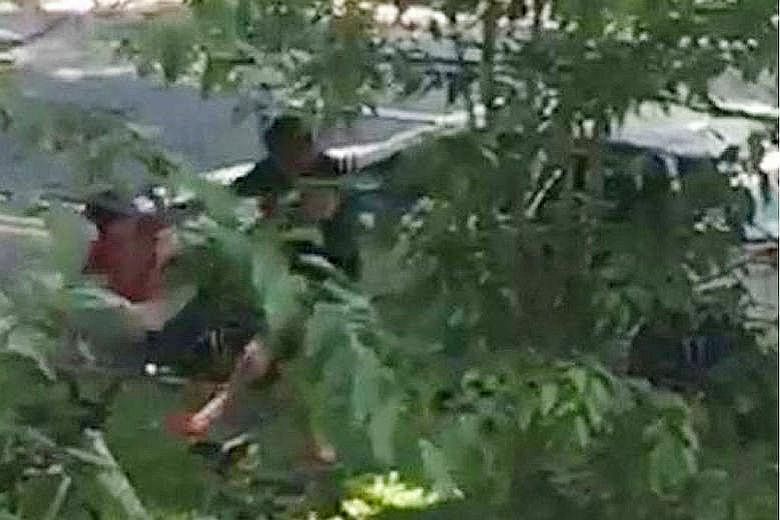 A video sent to Stomp shows a man dragging a child out of the car and throwing him to the ground. When the boy dashes back into the car, the man pulls him out again.