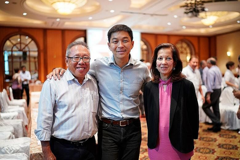 Singapore National Olympic Council president Tan Chuan-Jin (centre) with outgoing vice-presidents Low Teo Ping and Annabel Pennefather at the AGM.