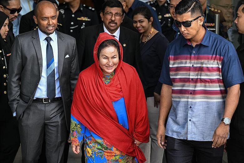 Datin Seri Rosmah Mansor leaving the Malaysian Anti-Corruption Commission (MACC) headquarters in Putrajaya yesterday afternoon after giving a statement. She had arrived at the agency at 10.45am, accompanied by her lawyers K. Kumaraendran and Geethan 