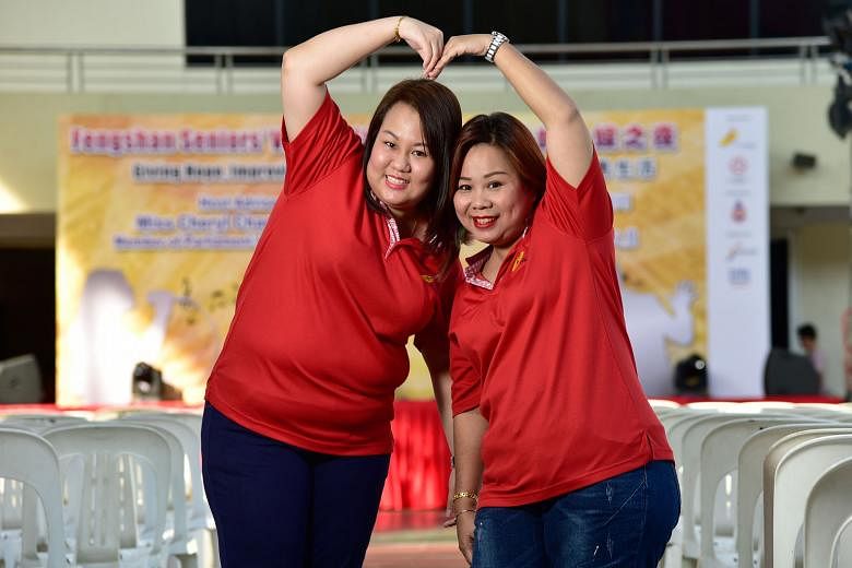 Miss Kelly Goh (far left) with family friend Stella Soh, who took the young woman in and looked after her after her parents died. Ms Soh, a 45-year-old mother of three, said: "I couldn't bear to send Kelly back home alone. She was traumatised. It was