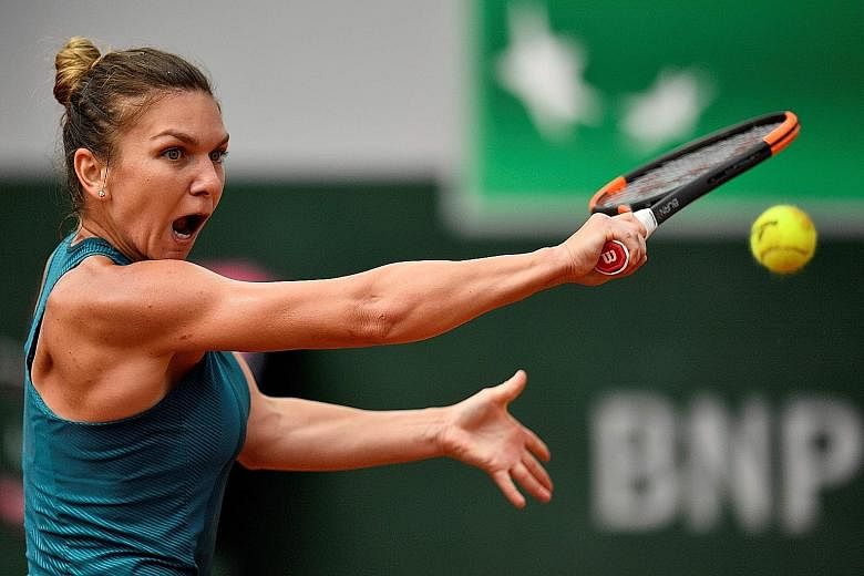 Simona Halep in action against Angelique Kerber during their French Open quarter-final yesterday. The Romanian changed tactics after dropping the first set, recovering her composure to win 6-7 (2-7), 6-3, 6-2.