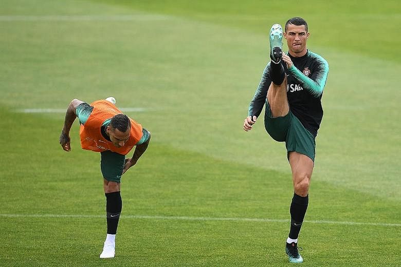 Portuguese forwards Cristiano Ronaldo (right) and Ricardo Quaresma during a training session in preparation for the World Cup Finals next week. Following their Euro 2016 win, Portugal will be hoping for success in Russia with their star player Ronald