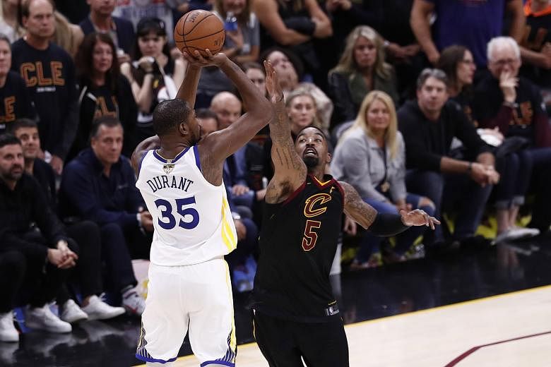 Golden State forward Kevin Durant shooting the crucial three-pointer over Cleveland guard J.R. Smith with under a minute left of Game 3 in the NBA Finals. His heroics were sorely needed as the Warriors' second-highest scorer Stephen Curry had only 11