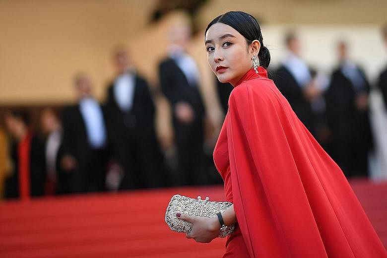 Wire agencies mistook Ms He Chengxi (above), who was at the Cannes Film Festival, for actress Fan Bingbing.