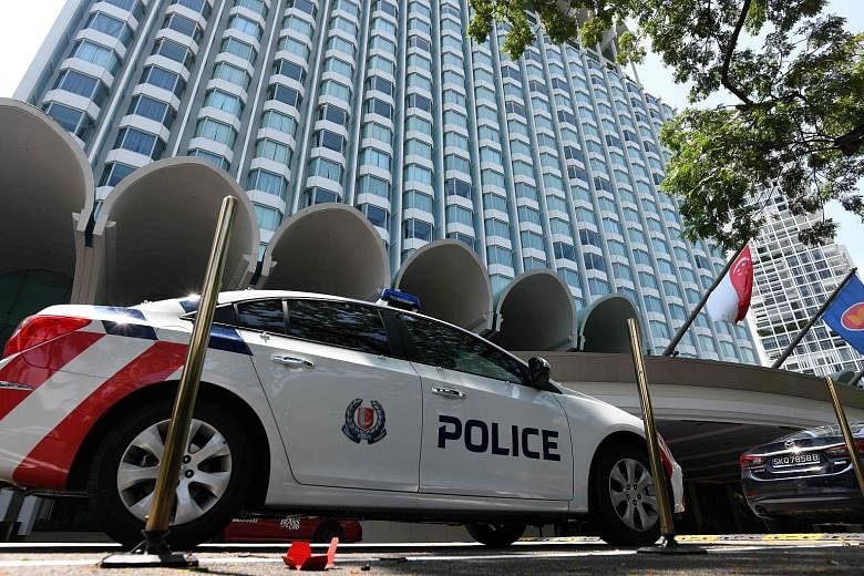 Police presence yesterday at Shangri-La Hotel, where US President Donald Trump will reportedly stay during the summit. Local security forces have been "working around the clock" to ensure a successful summit, said Mr K. Shanmugam.