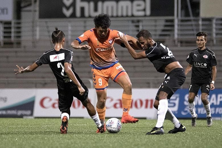 Albirex Niigata striker Shuhei Hoshino is sandwiched by Home United players. He scored two goals in a 3-0 win at the Jurong East Stadium, including an opener borne out of a piece of improvisation from the league leaders.