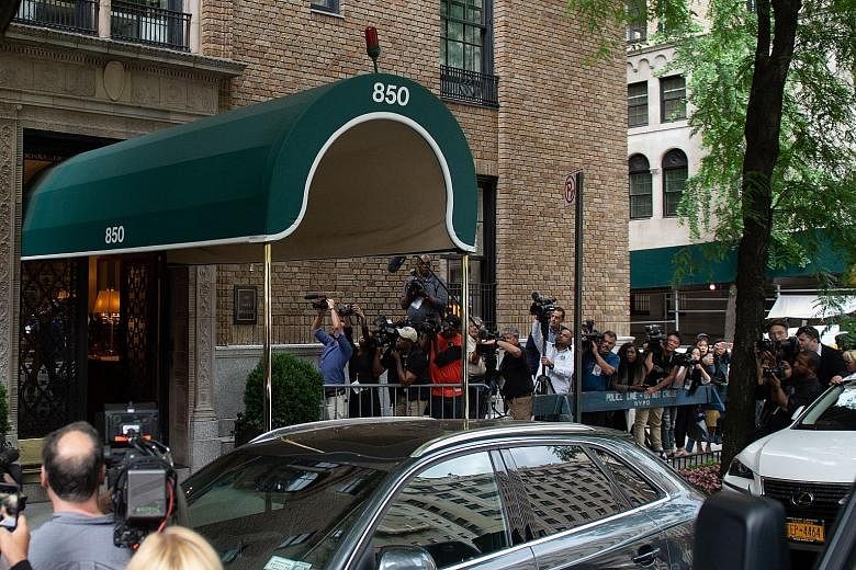 Journalists gathered outside fashion designer Kate Spade's apartment after she was found dead last Tuesday in New York.